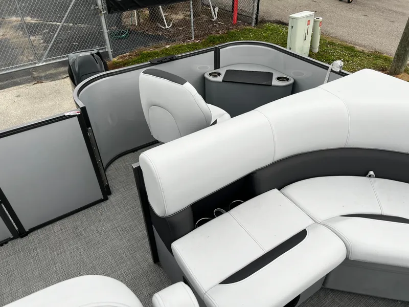 Slide: The Image of 2024 Bentley Pontoons LE 180 3 PT interior with modern seating and storage. - 10