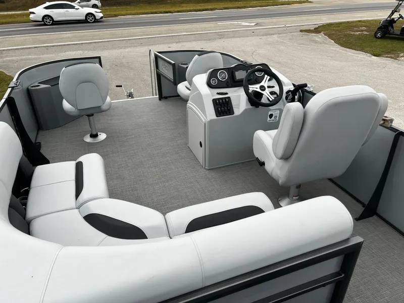 Slide: The Image of 2024 Bentley Pontoons LE 180 3 PT interior with seating and steering console. - 11