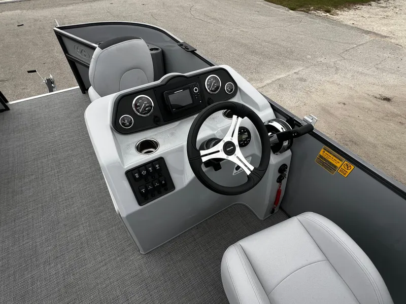 Slide: The Image of 2024 Bentley Pontoons LE 180 3 PT boat dashboard and steering wheel. - 14