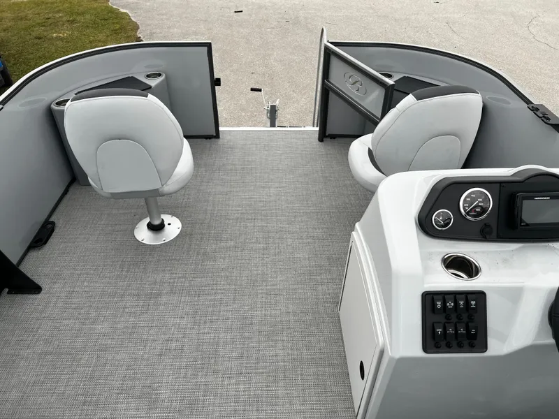 Slide: The Image of 2024 Bentley Pontoons LE 180 3 PT interior with seating and control panel. - 16