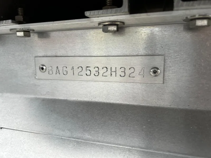 Slide: The Image of Hull Identification Number (HIN) plate on a 2024 Bentley Pontoons LE 180 3 PT. - 20