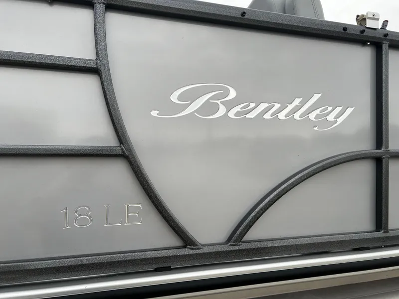 Slide: The Image of 2024 Bentley Pontoons LE 180 3 PT side panel with logo and model details. - 21