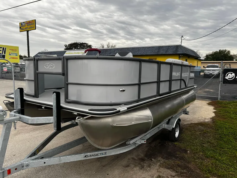 Slide: The Image of 2024 Bentley Pontoons LE 180 3 PT on trailer in dealership lot. - 3