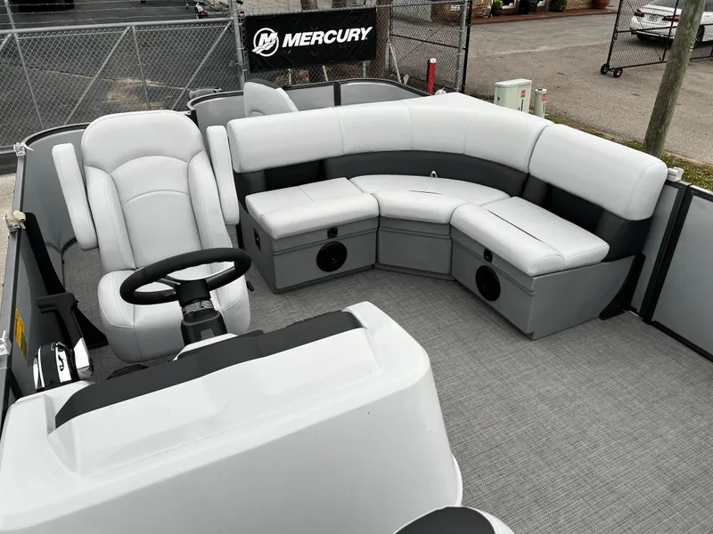 Slide: The Image of 2024 Bentley Pontoons LE 180 3 PT interior with gray seating and steering console. - 9