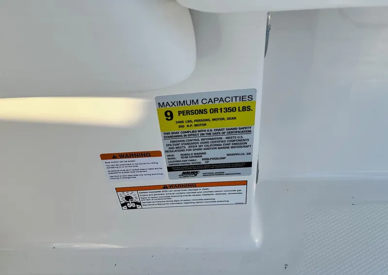 Slide: The Image of 2024 Robalo 246 Cayman boat capacity label, maximum 9 persons or 1350 lbs. - 21