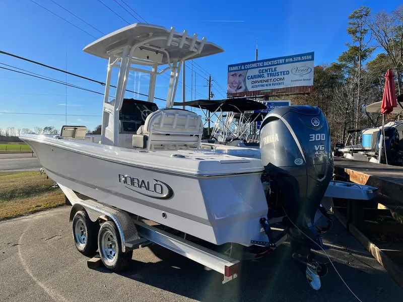 Slide: The Image of 2024 Robalo 246 Cayman boat on trailer with Yamaha 300 V6 engine. - 4