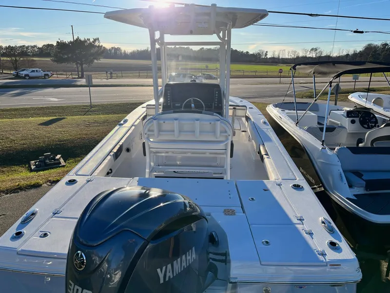 Slide: The Image of 2024 Robalo 246 Cayman boat with Yamaha 300 engine, docked outdoors. - 5