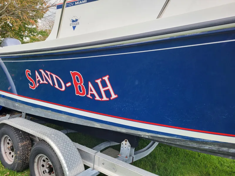 Slide: The Image of 2018 Steiger Craft 21 DV MIAMI boat named SAND-BAH on a trailer. - 10