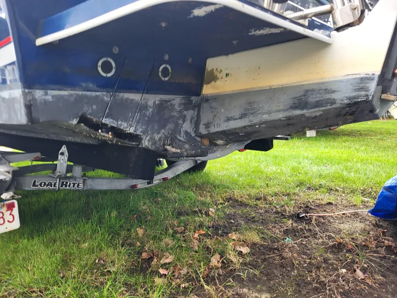 Slide: The Image of 2018 Steiger Craft 21 DV MIAMI boat on Load Rite trailer, showing hull damage. - 18
