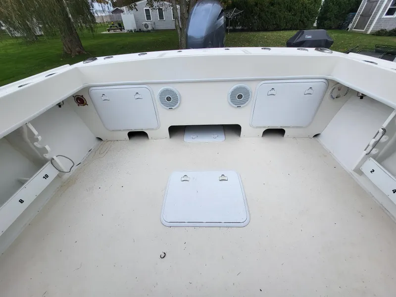 Slide: The Image of 2018 Steiger Craft 21 DV MIAMI boat deck with storage compartments and speakers. - 27