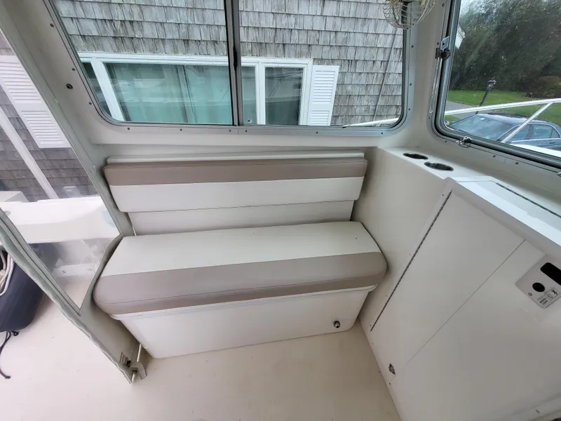 Slide: The Image of Interior seating of 2018 Steiger Craft 21 DV MIAMI boat with beige and white cushions. - 43