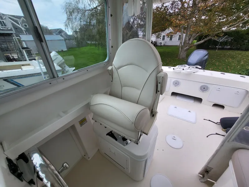 Slide: The Image of 2018 Steiger Craft 21 DV MIAMI boat interior with captain's chair and console. - 46