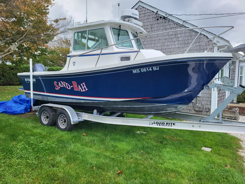 Slide: The Image of 2018 Steiger Craft 21 DV MIAMI boat on trailer in front of house. - 6