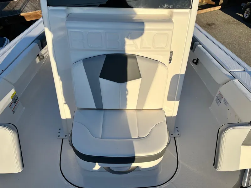 Slide: The Image of 2024 Robalo 246 Cayman boat seat with white and gray upholstery. - 16