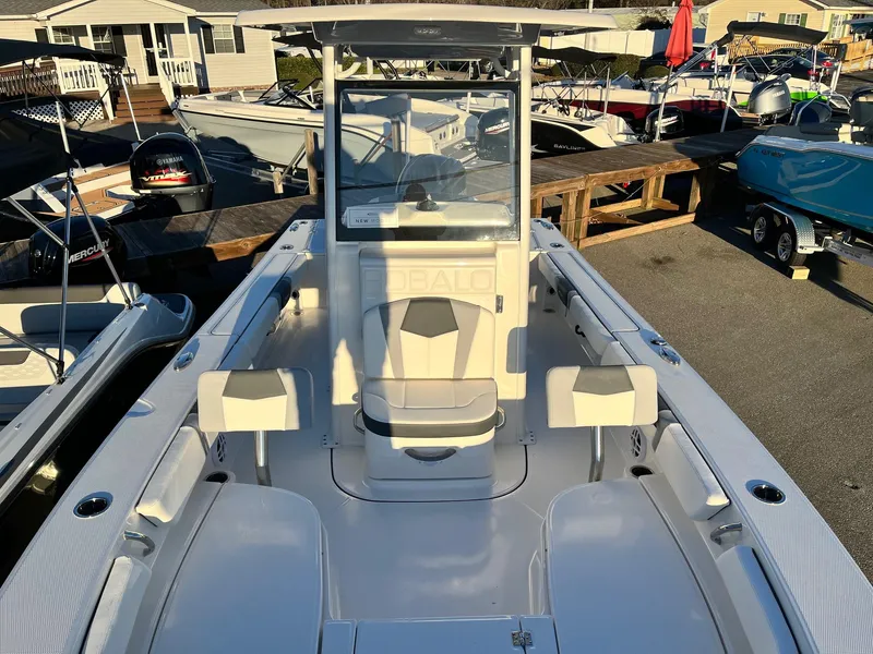 Slide: The Image of 2024 Robalo 246 Cayman boat interior with seating and console. - 20
