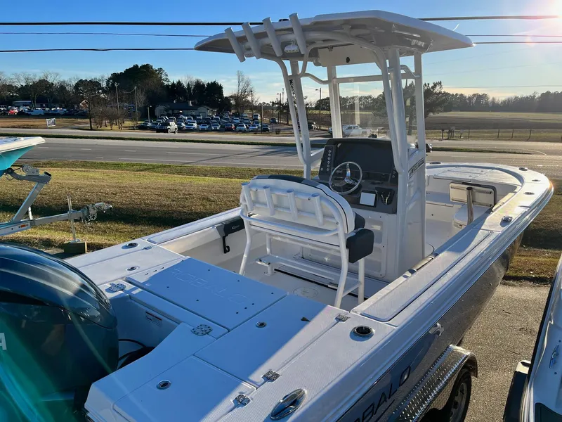 Slide: The Image of 2024 Robalo 246 Cayman center console boat with T-top and outboard motor. - 6