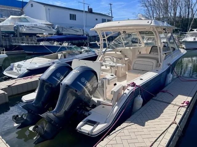 The Image of 2019 Grady-White Freedom 325 boat docked with twin Yamaha engines. - 1