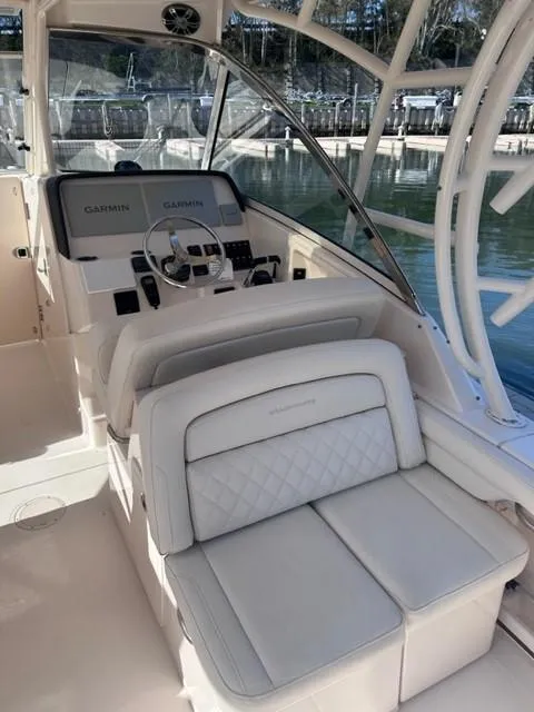 Slide: The Image of 2019 Grady-White Freedom 325 boat interior with Garmin navigation system. - 10