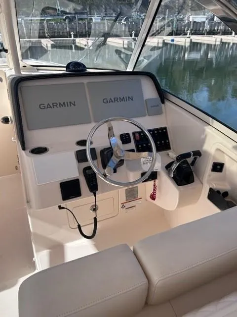 Slide: The Image of 2019 Grady-White Freedom 325 boat helm with Garmin navigation system. - 11