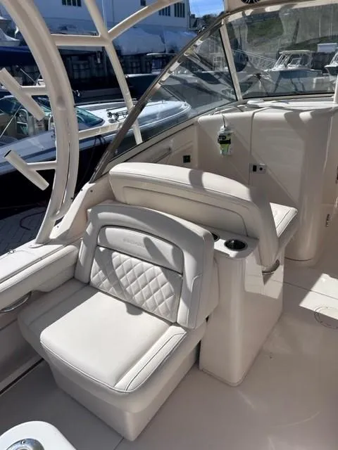 Slide: The Image of 2019 Grady-White Freedom 325 boat interior with white leather seating. - 14
