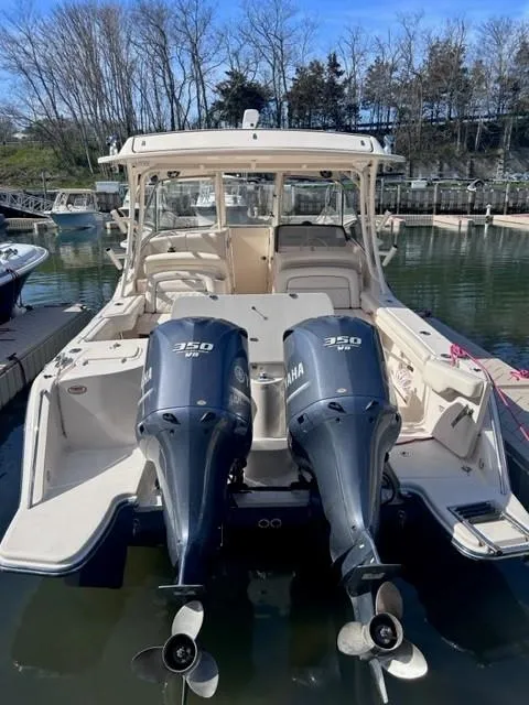 Slide: The Image of 2019 Grady-White Freedom 325 boat with twin Yamaha 350 engines docked. - 2