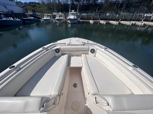 Slide: The Image of 2019 Grady-White Freedom 325 boat bow seating area at marina. - 3