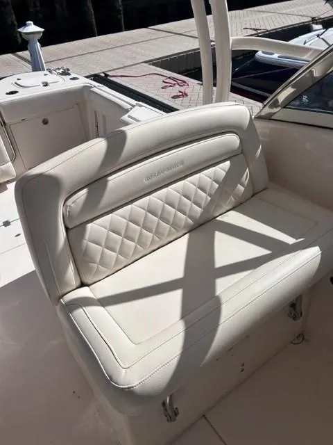 Slide: The Image of 2019 Grady-White Freedom 325 boat with white cushioned seating. - 8