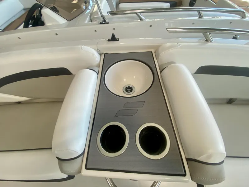 Slide: The Image of 2024 Starcraft SVX 191 boat interior with cup holders and sink. - 15