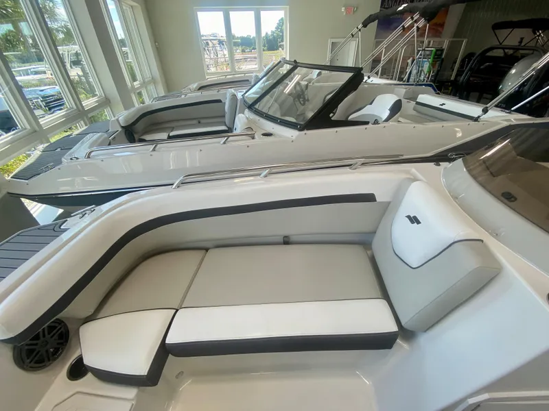 Slide: The Image of 2024 Starcraft SVX 191 boats on display in a showroom. - 19