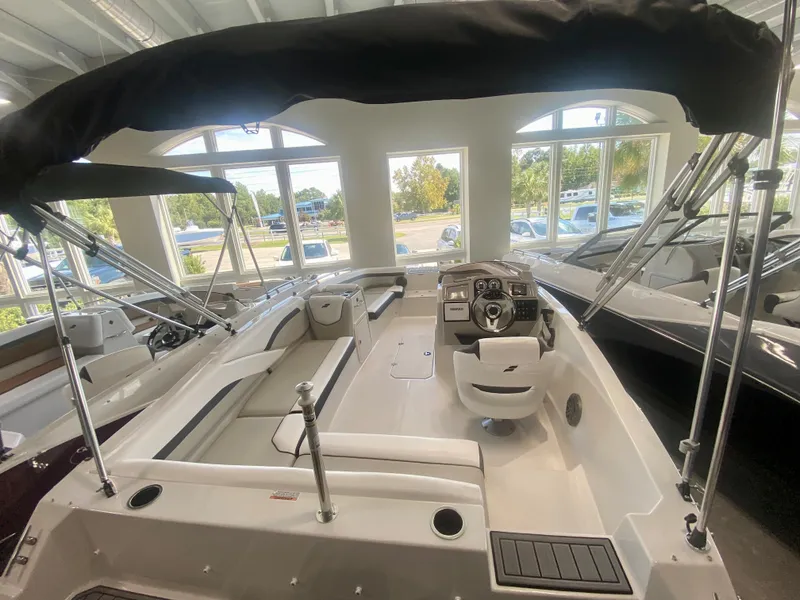 Slide: The Image of 2024 Starcraft SVX 191 boat interior with canopy in showroom. - 4