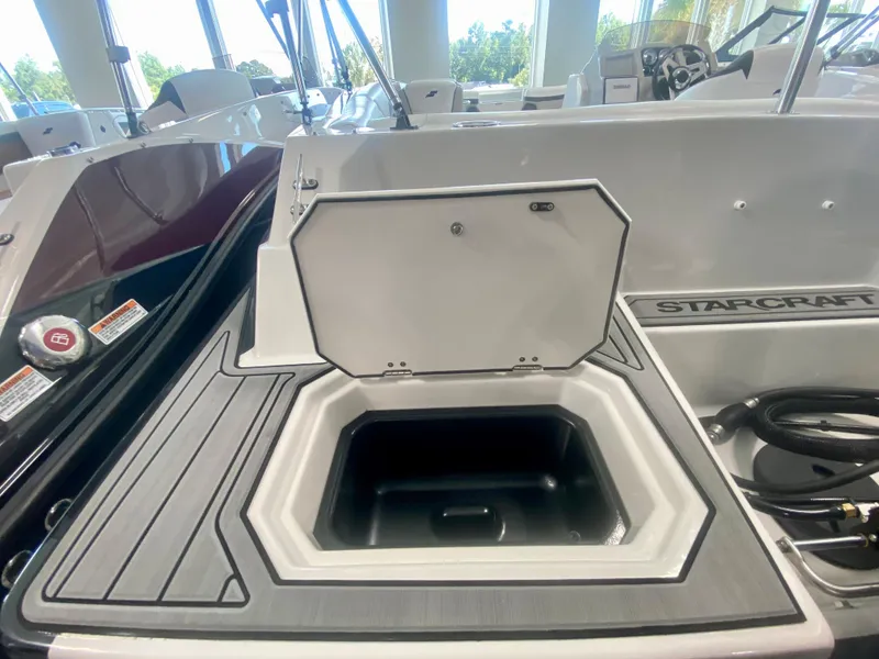 Slide: The Image of 2024 Starcraft SVX 191 boat with open storage compartment. - 6