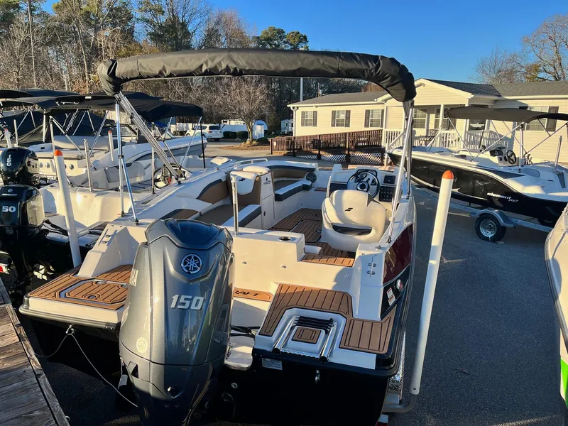 Slide: The Image of 2024 Starcraft SVX 191 boat with Yamaha 150 outboard motor, docked at marina. - 3