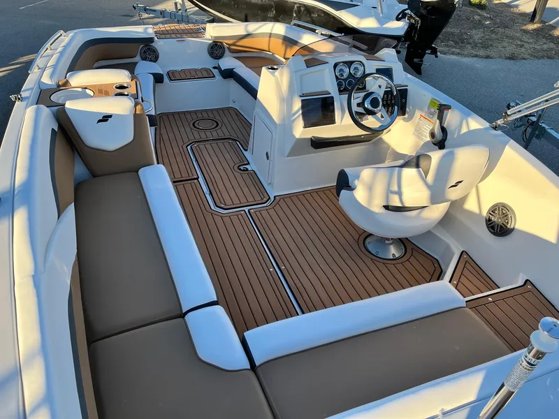Slide: The Image of 2024 Starcraft SVX 191 boat interior with tan and white seating and modern dashboard. - 4