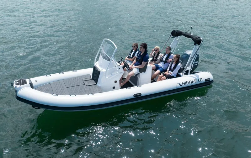 Slide: The Image of 2024 Highfield Sport 660 boat with passengers on water. - 16
