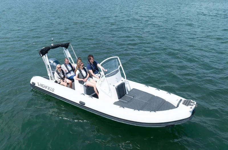 Slide: The Image of 2024 Highfield Sport 660 boat with passengers on open water. - 18