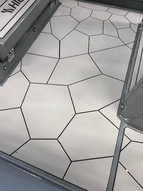 Slide: The Image of 2024 Highfield Sport 660 boat deck with geometric pattern. - 8