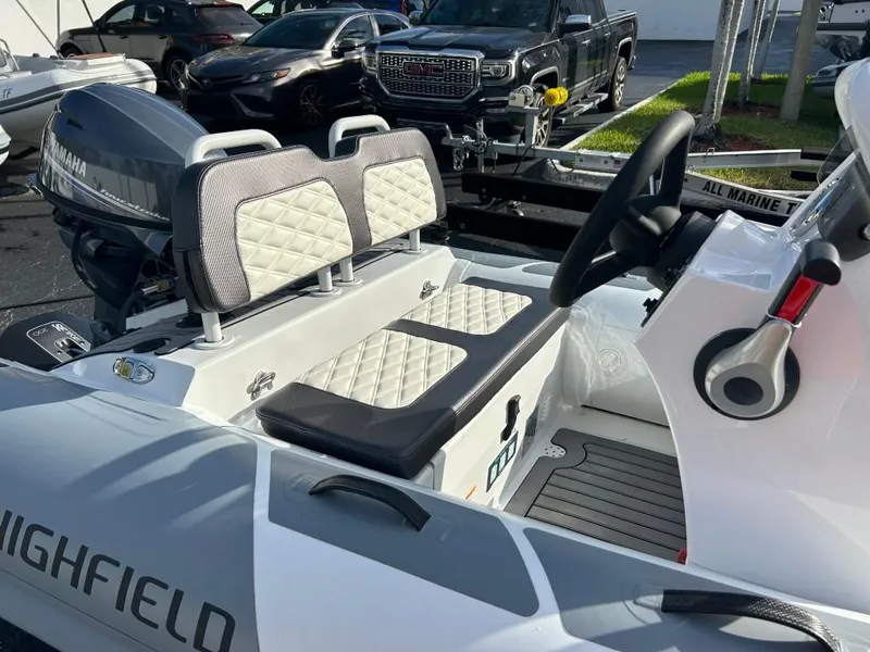 Slide: The Image of 2023 Highfield Sport 330 boat interior with Yamaha engine and dual seats. - 14