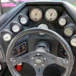Slide: The Image of 1993 American Skier Legend dashboard with steering wheel and gauges. - 10