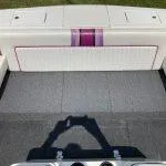 Slide: The Image of 1993 American Skier Legend boat interior with white and purple upholstery. - 5