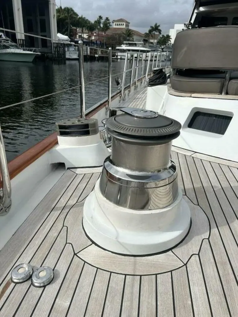 Slide: The Image of Alt text: 1983 Palmer Johnson 110 Cruising Sloop deck with winch and seating area. - 10