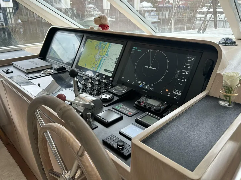 Slide: The Image of Control panel of a 1983 Palmer Johnson 110 Cruising Sloop with navigation screens. - 28