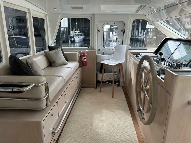 Slide: The Image of Interior of 1983 Palmer Johnson 110 Cruising Sloop with helm, seating, and navigation equipment. - 29