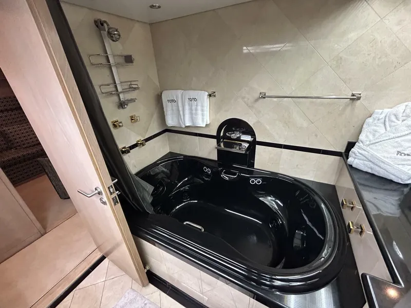Slide: The Image of Luxurious black bathtub in 1983 Palmer Johnson 110 Cruising Sloop yacht bathroom. - 36