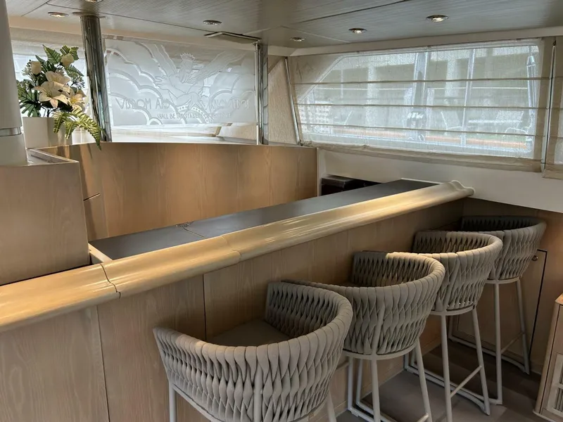 Slide: The Image of Luxurious interior of 1983 Palmer Johnson 110 Cruising Sloop with bar and seating area. - 46