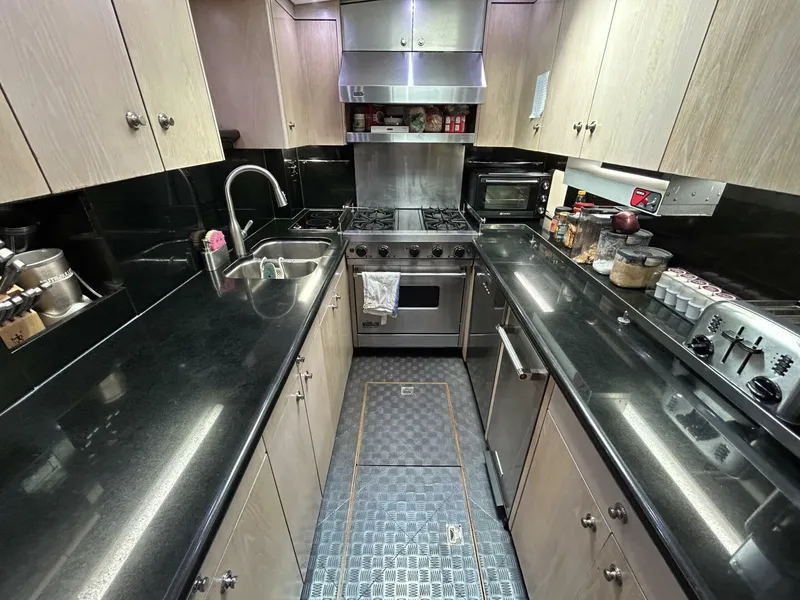 Slide: The Image of Modern kitchen in a 1983 Palmer Johnson 110 Cruising Sloop yacht. - 48