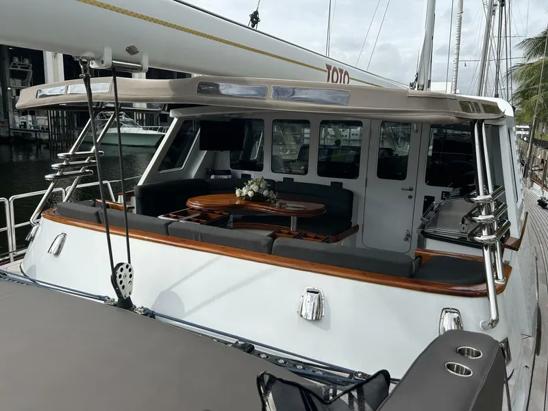 Slide: The Image of 1983 Palmer Johnson 110 Cruising Sloop with spacious deck and elegant seating area. - 7
