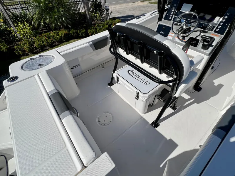 Slide: The Image of 2024 Robalo R230 boat interior with seating, console, and cooler. - 10