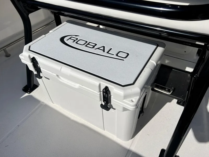 Slide: The Image of Robalo R230 2024 model cooler under seat on boat deck. - 16