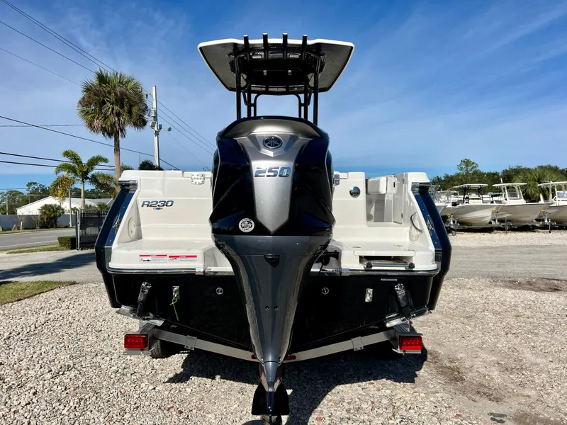 Slide: The Image of 2024 Robalo R230 boat with Yamaha 250 outboard motor, rear view. - 2