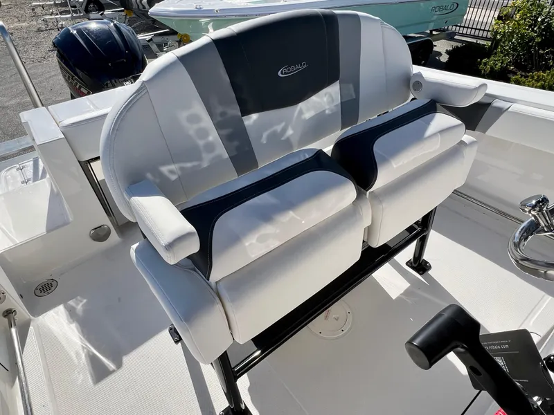 Slide: The Image of 2024 Robalo R230 boat seating with cushioned armrests and backrest. - 21